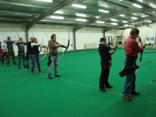 A row of archers on the shooting line
